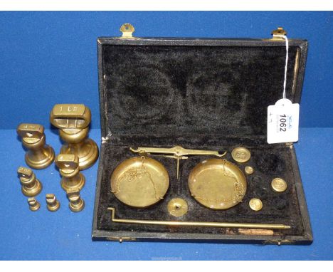 A 19th century set of folding brass dish scales in black leather case with four original weights, plus another set of vintage