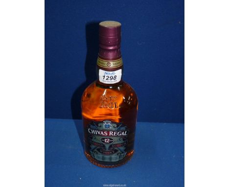 A 70 cl. bottle of Chivas Regal Scotch whisky, aged for 12 years in hand-crafted casks.