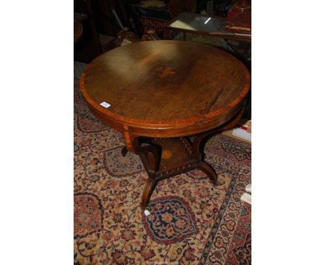 A rosewood and other woods Edwardian circular occasional Table, the cross-banded top with light and darkwood stringing having