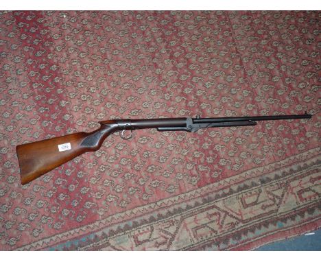 A B.S.A. under-lever cocking action .177 / 4.5 mm calibre Air Rifle having a 17" long barrel and chequered pistol grip stock.