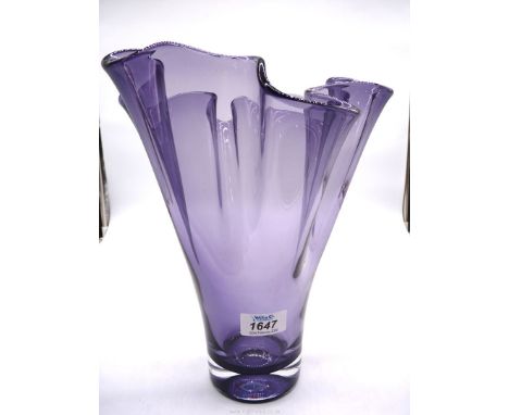 A heavy ruffled handkerchief style glass vase in purple with smooth rounded rim and having and having polished concave base g
