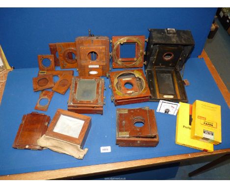 A quantity of camera components to include: wooden plate frames, film reel, a meter, etc.
