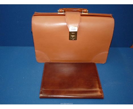 A tan leather briefcase by Dolphin and a document wallet.