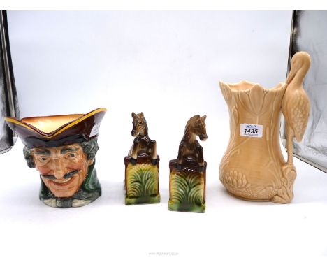 A large Sylvac jug with stork handle, 10" tall, large Royal Doulton Dick Turpin character jug, 6 1/2" tall and a pair of hors