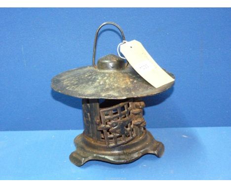 An oriental cast iron Lantern, 8" tall.
