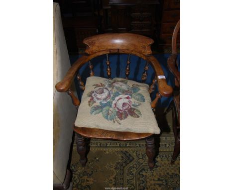 A solid Elm seated Captains Chairs having turned legs, stretchers and back supports, sold together with tapestry cushion.