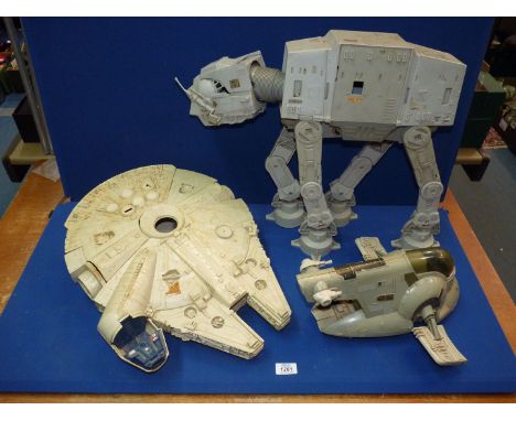 A Stars Wars model of an AT-AT Walker (mostly complete) and the Millenium Falcon dated 1979 Kener Production (some parts miss