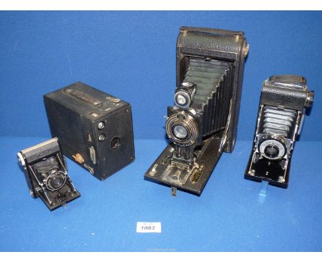 Four vintage cameras to include: Kodak, King Penguin Kershaw, eight-20, Zeis Ikon, etc.