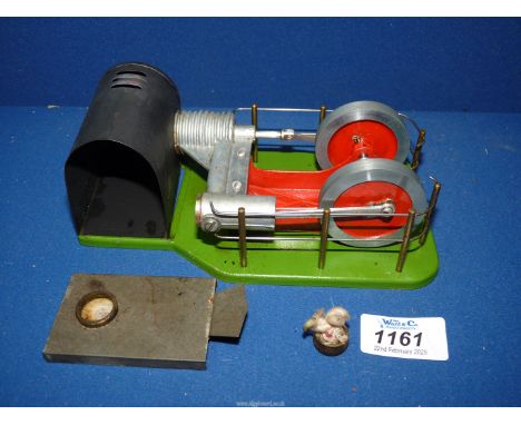 A boxed "Made in Great Britain" industrial style model twin flywheel hot air (Sterling Cycle) Engine mounted on a cast metal 