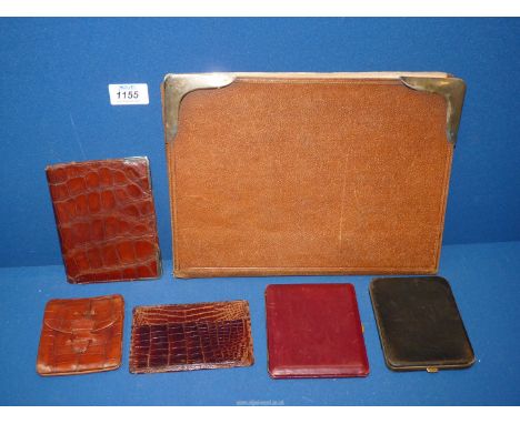 A small quantity of leather items to include: an Asprey of London crocodile skin wallet with silver mounted corners dated 194