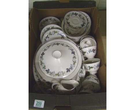 A collection of Royal Doulton dinner and tea ware in the Bergundy design including tureen & cover, large platters, cups and s