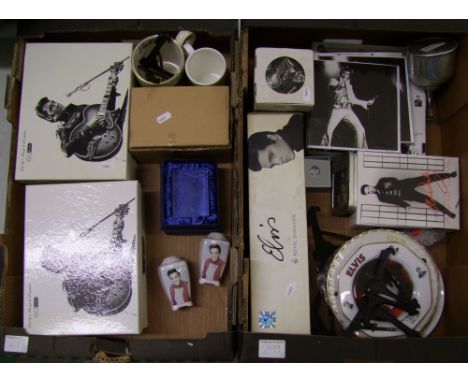 A collection of boxed Elvis inspired items to include - mug and coaster sets, alarm clocks, Royal Doulton mug set, porcelain 