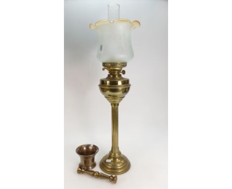 Tall brass oil lamp with its shade together with a heavy brass mortar and pestle (2)