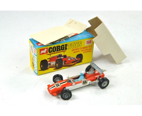 Corgi No. 158 Lotus Climax F1 Racing Car. Orange / White with No. 8 racing stripes, driver figure. Generally excellent, in ex