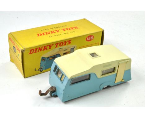 Dinky No. 188 Four Berth Caravan. Two tone cream, light blue with chrome spun hubs. Generally very good, the odd minor mark p