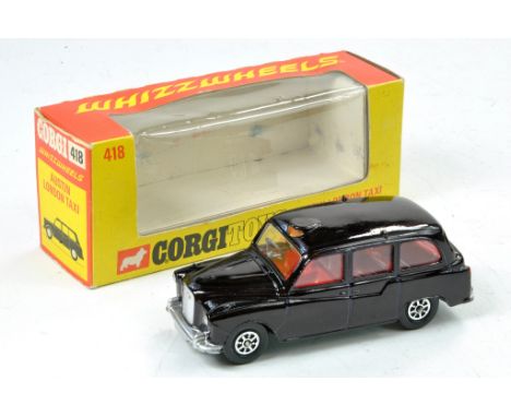 Corgi Whizzwheels No. 418 Austin London Taxi. Maroon with Red Interior. Only a couple of specks of wear hence excellent in ge