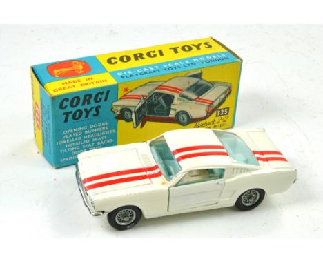 Corgi No. 325 Ford Mustang Fastback 2+2 Competition Model. White with Red Stripes, pale blue interior. Wire Wheels. Driver Fi