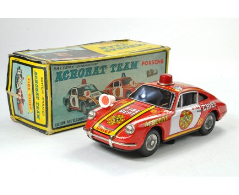 1960’s TPS Japan Battery Operated Tinplate Acrobat Team Porsche 911S Fire Chief.  Appears in good working condition, with lig