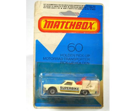 Matchbox Superfast No. 60D Holden Pickup. White with Red Interior, Unpainted Base. Red Bikes. Excellent,  in Very good Bliste