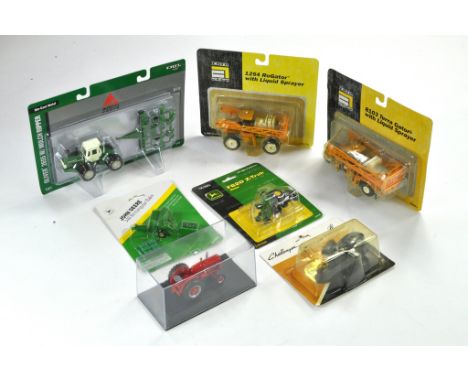 Assortment of 1/64 Farm Toy / Model issues including Challenger, Rogator and others. Excellent, cards a little dusty. 
