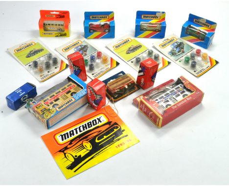 A group of Matchbox carded paint plus Corgi diecast issues including Matchbox Buses. 