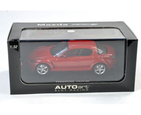 Slot car interest comprising Auto Art No. 13032 Mazda RX-8 (Velocity red) Slot car with lighting lamps. Appears excellent in 