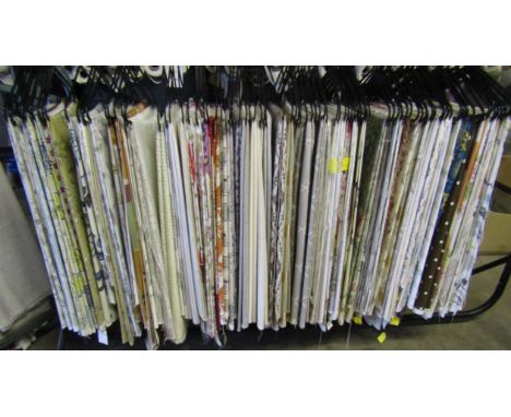 Rail of mainly patterned fabrics mostly Prestigious Textiles, Ashley Wild and some Clarke &amp; Clarke - each piece between 1