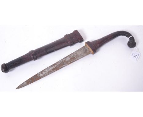 A vintage Indian ceremonial dagger knife, with a carved handle