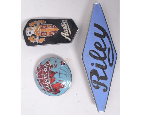 CAR BADGES: A collection of 3x vintage classic car enamel and chrome badges: black Austin badge, a globe shaped Triumph blue 