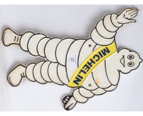 MICHELIN MAN: A vintage style cast iron Michelin Man advertising sign, in the shape of Bibendum, arm raised, with notation to