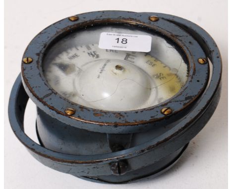 A vintage Sestrel gimbal ships deck compass, within the original circular surround. The dial stamped ' Sestrel '. Oil filled.