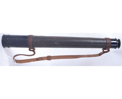 A vintage military style Busch telescope ( 20x magnification) with original leather strap. 51cm when closed