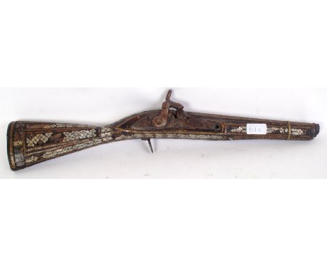 An early 19th century Ottoman mother of pearl musket. The mechanism being marked for 1806 EVIC - Leigh Gilded banded with  Oc