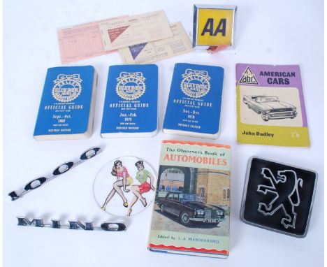 AUTOMOBILIA: A collection of vintage motoring / car memorabilia to include; Morris 1000 badge ( 'Mino ' ), Kelleys Guides, vi
