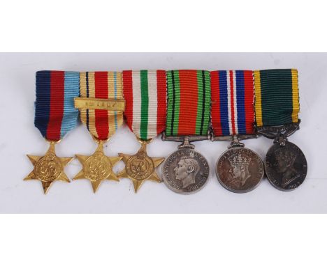 MINIATURE MEDAL GROUP; A WWII Second World War military miniature medal group, including the 39-45 Star, Africa Star (with 8t