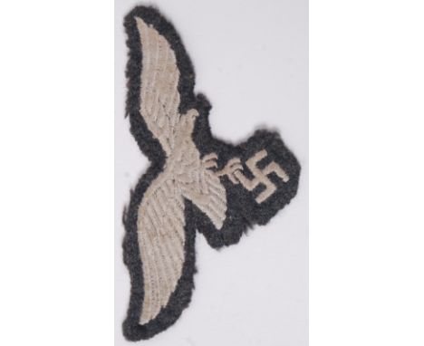A Third Reich / Nazi second world war WWII era Luftwaffe tunic eagle uniform cloth patch. 