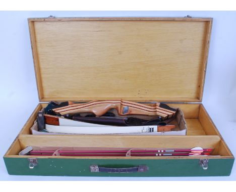 ARCHERY SET; A vintage original Sam Wha Conquest 144 archery bow and arrow competition set. Within the original wooden case. 