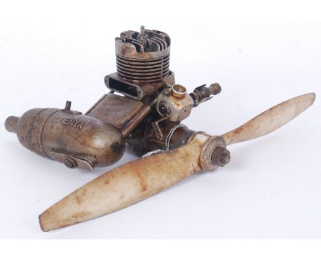 A vintage model aircraft engine - Enya 35 Model 5224. Cast alloy construction with notation in several places. 