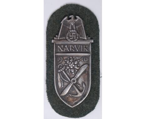 A WWII Second World War era Nazi Third Reich German Narvik Shield badge / patch for the Campaign In Norway. Decorated with th