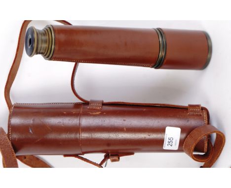 TELESCOPE: A vintage post-WWII leather bound four draw brass telescope. Within the original case. Markings to side; Tel Sct R