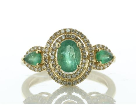 A unique ring, with an oval emerald surrounded by a double halo of diamonds with a gap in between the haloes. One pear shaped