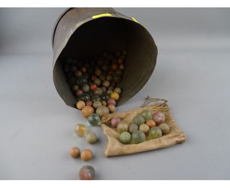 Tin containing a quantity of vintage marbles