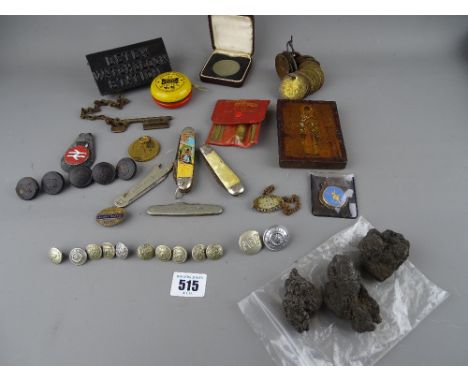Interesting box of collectables including British Rail and LNER buttons and badges, a cast metal Detex watch clock station wi