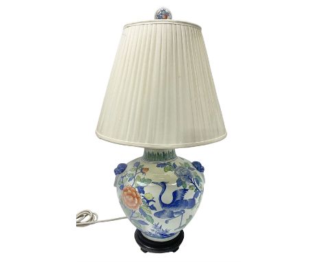 Table lamp of baluster form, decorated with birds and peonies, on a wooden pedestal, including shade H161cm