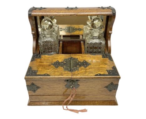 Victorian oak tantalus, mirrored high-back with recess for housing the decanters, behind a hinged box, with cribbage board to