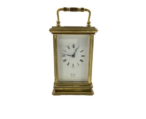 English - 20th century 8-day carriage clock, in a brass case with a white enamel dial, Roman numerals, minute track and steel
