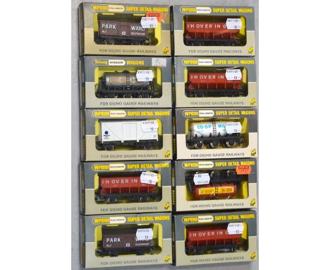 Tri-ang Wrenn H0/00 gauge rolling stock comprising two W5026 mineral wagons, a W5066 beer tanker, a W5086 six-wheeled wagon, 