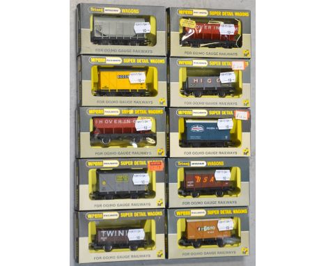 Tri-ang Wrenn H0/00 gauge rolling stock comprising a W5075 Twinings wagon with load, a W5009 gun powder van, a W5065 insulato