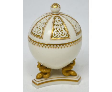 An unmarked Royal Worcester white glazed gilt-heightened porcelain pot-pourri with reticulated domed cover in the style of Ge