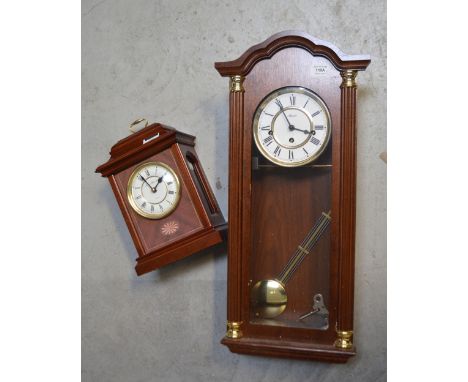 A Hermle wall clock, dial set with Roman numerals, height 62cm and a London Clock Company Quartz mantel clock, dial set with 